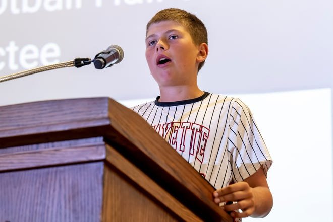 Clayton Richard's children introduced him for induction into the Indiana Football Hall of Fame, presented by Chris Meeks at the National Football Foundation's Joe Tiller Chapter Honors Brunch, Sunday, June 9, 2024 in West Lafayette, Ind.